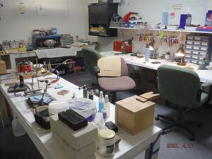 Workshop with tools and workstations, well-organized.